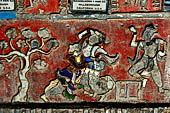 Glass mosaics depicting Buddhist stories lining walls around stupa in Shwe Yaunghwe Kyaung. Buddhist monastery, near Inle Lake. Myanmar. 